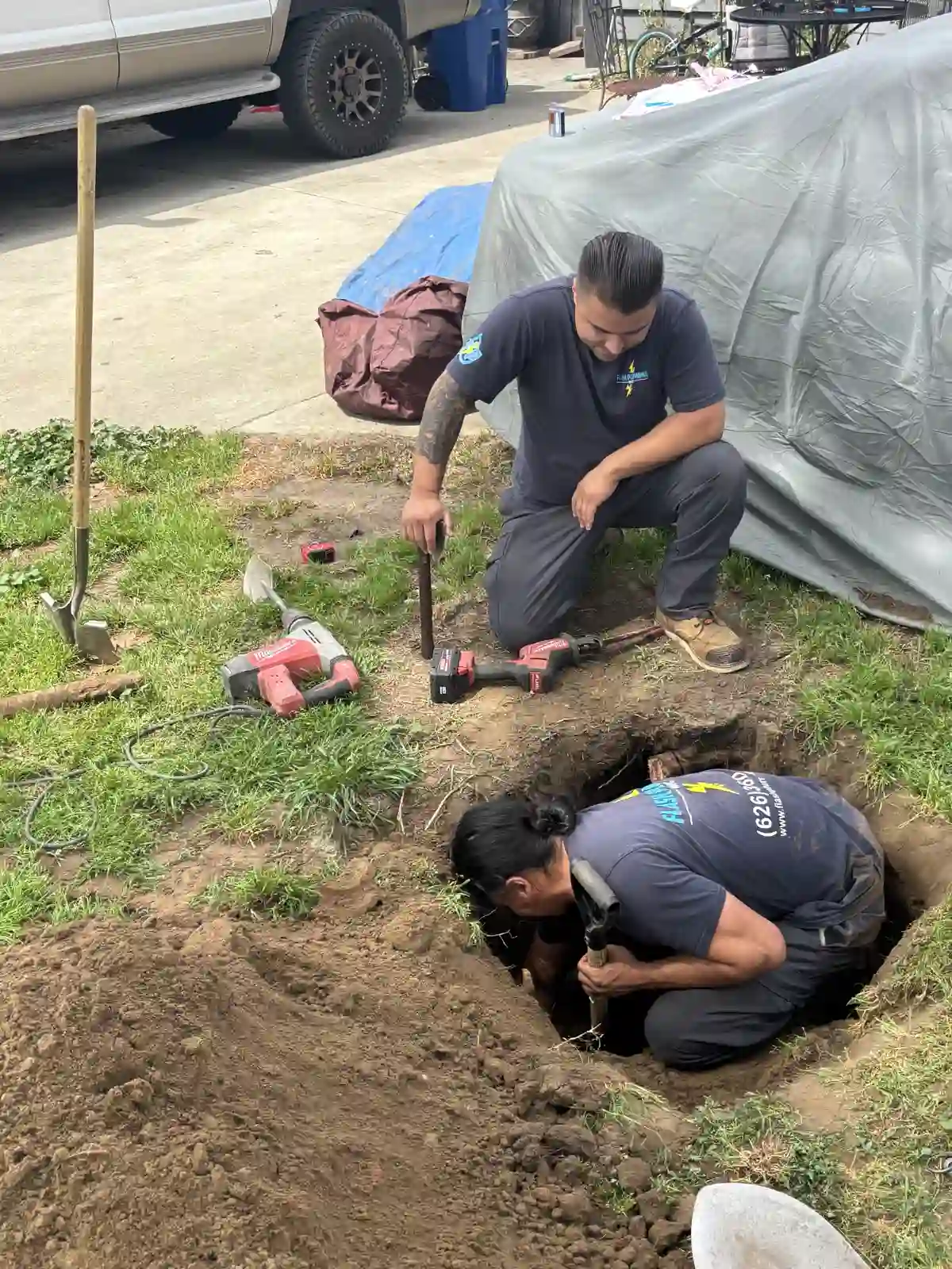 Flash Plumbing Inc. technicians repairing a sewer line on a residential job site in Covina