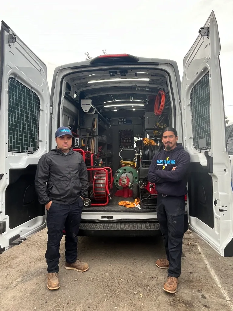 Flash Plumbing team at the service van