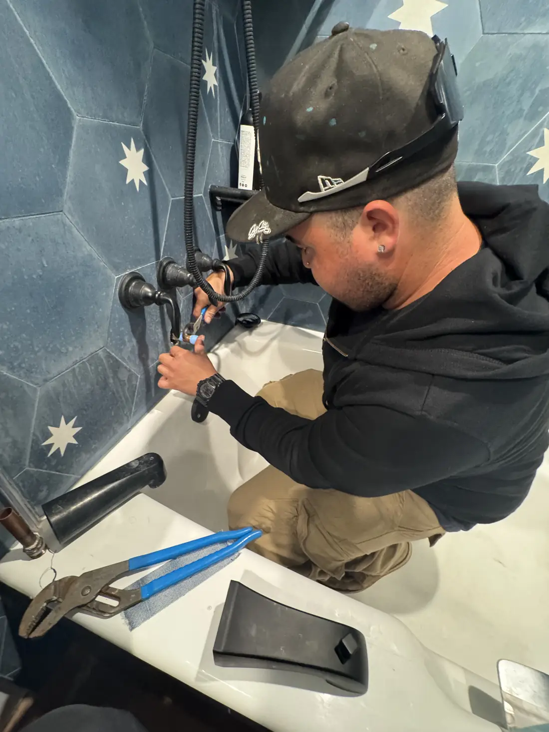 Flash Plumbing technician repairing a shower valve